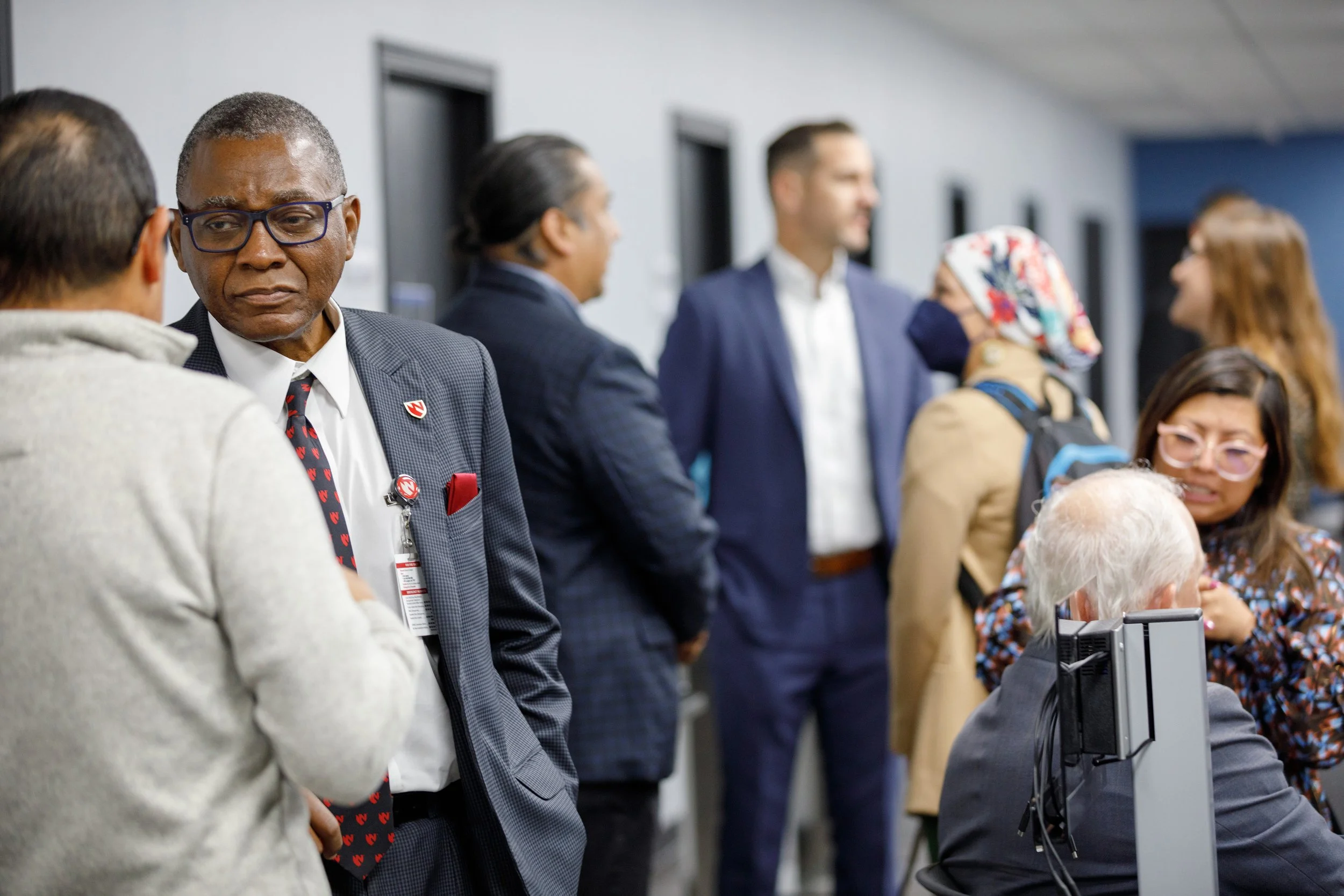 Dr. Dele Davies talks to community members in South Omaha