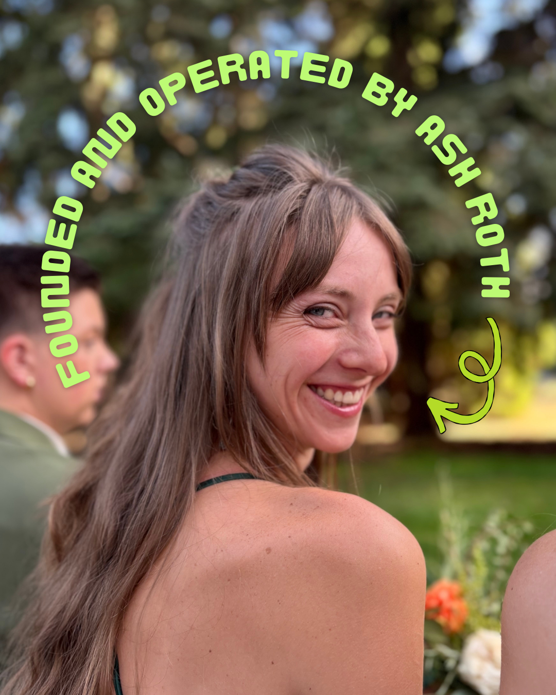 A woman smiling outdoors with green trees in the background, with text in green reading 'Founded and operated by Ash Roth' curved around her head.
