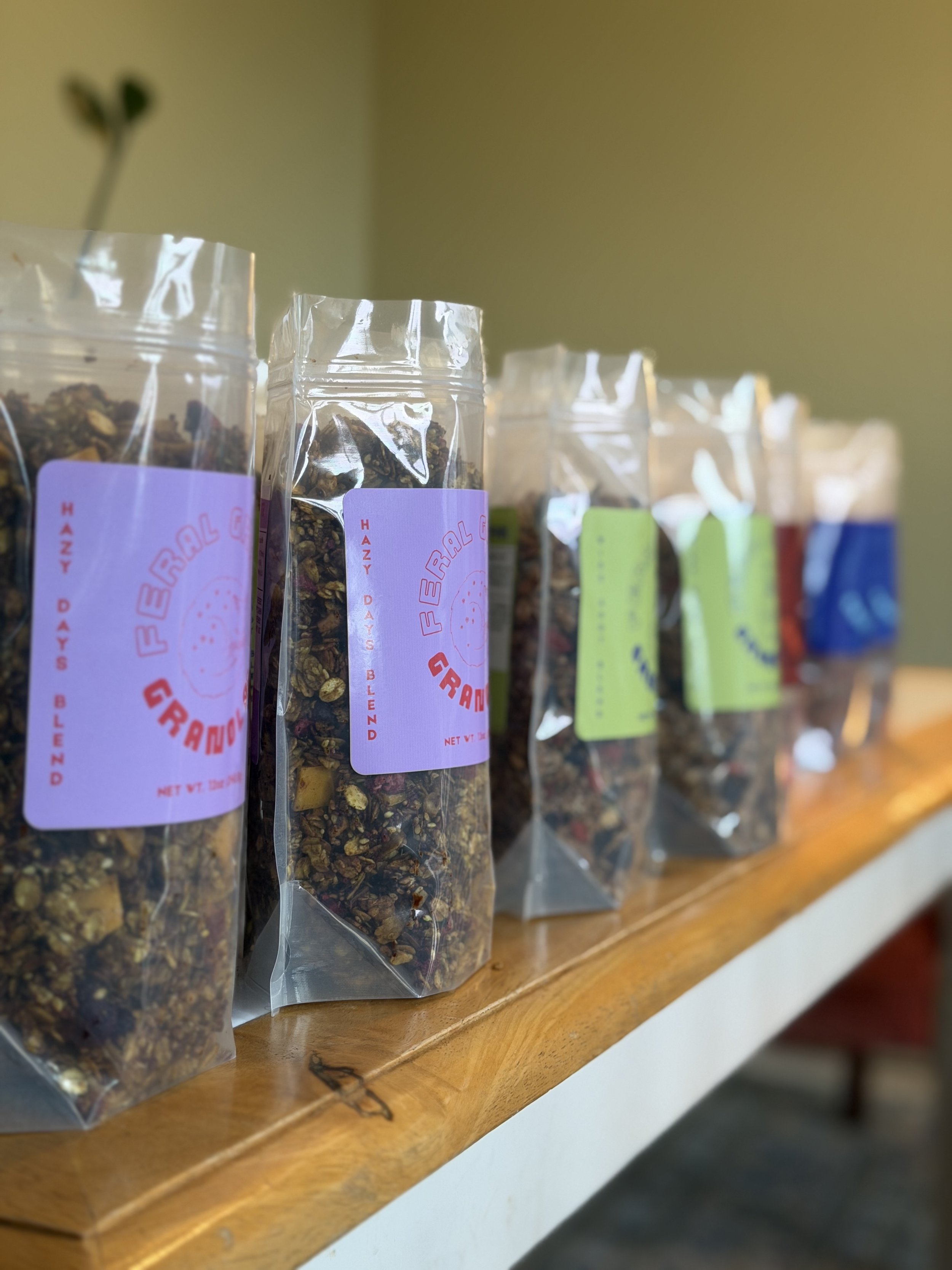 Home compostable bags filled with handmade, premium granola.