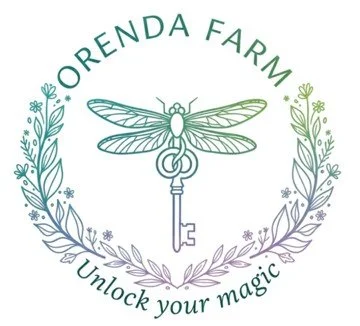 Logo for Orenda Farm featuring a dragonfly perched on a key, surrounded by a floral wreath with the text "Orenda Farm" and "Unlock your magic".
