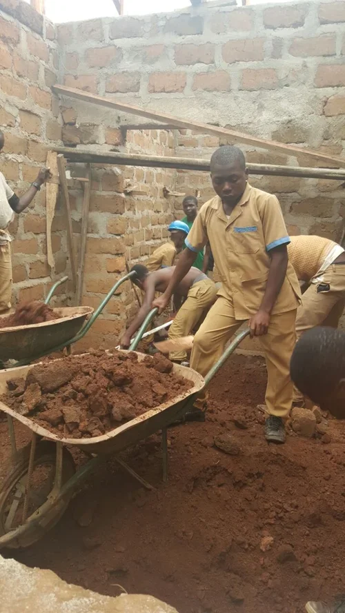 Service Project - School Construction: 
ScholarShop students are encouraged to get involved in their communities and lead the change they want to see. When funding for a local primary school came through, participants went out two days in a row to he
