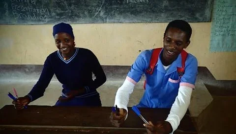 Asmau Musa & Habilu Haruna GSS Upkwa, Form 5: 
Asmau: I always go to school very early in the morning. I obey my teachers and my brothers and sisters. I like reading books in school and even in my compound. My family earns money through farming and g