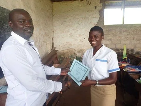 Tem Yoland: 
Tem Yoland is incredible.

She has a drive seen like no other child. She comes from a very impoverished home where her father was not around. Yoland is the reason ScholarShop exists. Yoland's potential is infinite, yet her means are limi