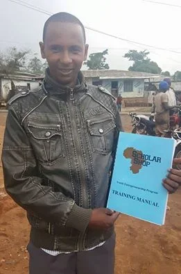 ScholarShop Tech Manual: 
Buba, co-facilitator at GSS Upkwa, showing off his newly printed ScholarShop Training Manual.

Apr 3, 2016