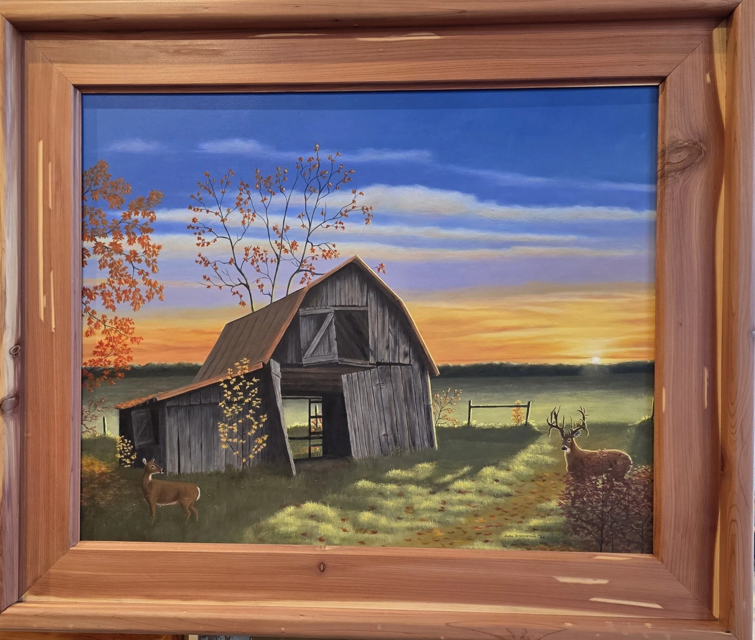 A rural landscape painting of a sunset sky with orange, blue, and purple hues. An old wooden barn leans to one side in the foreground, with a deer standing nearby and another deer in the distance. Trees with fall foliage are visible, and a fence runs across the background.
