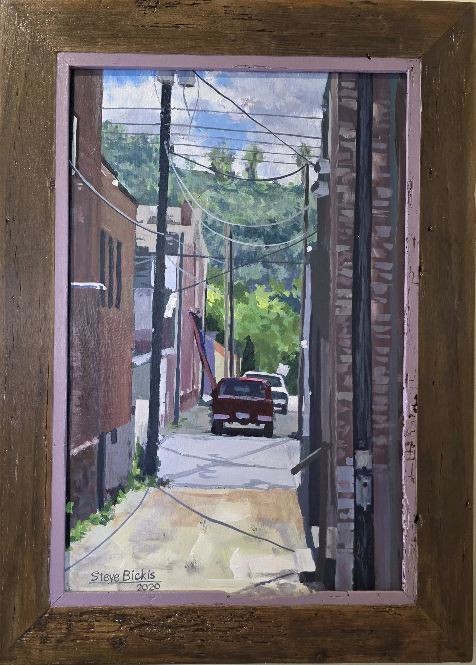 A painting of a narrow alley with utility poles and wires, parked cars, and buildings with trees in the background, signed by Steve Bickis in 2020.