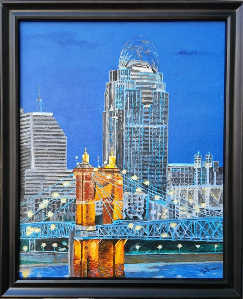 A painting of the Cincinnati skyline at night, featuring the John A. Roebling Suspension Bridge over the Ohio River and tall modern buildings, including the Great American Tower at Queen City Square.