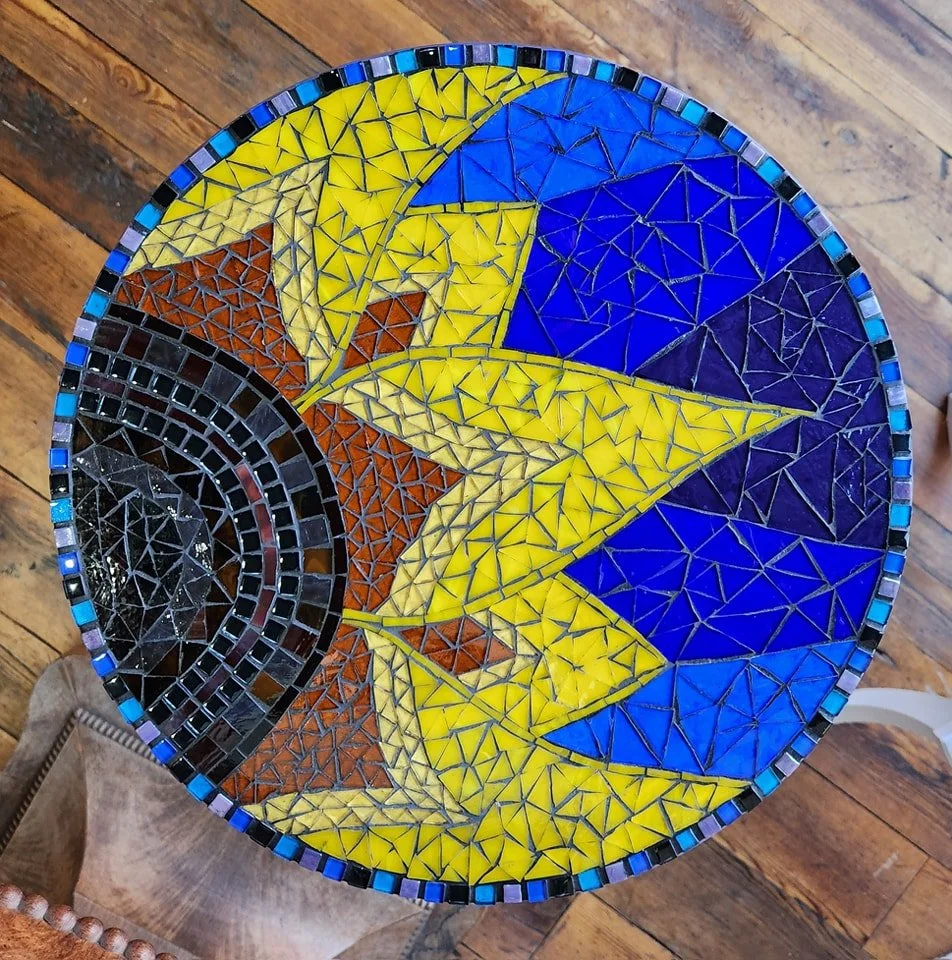 Colorful mosaic tabletop created by artist Lizzy Green,  located at the Community Art Center of Switzerland County in Vevay, Indiana