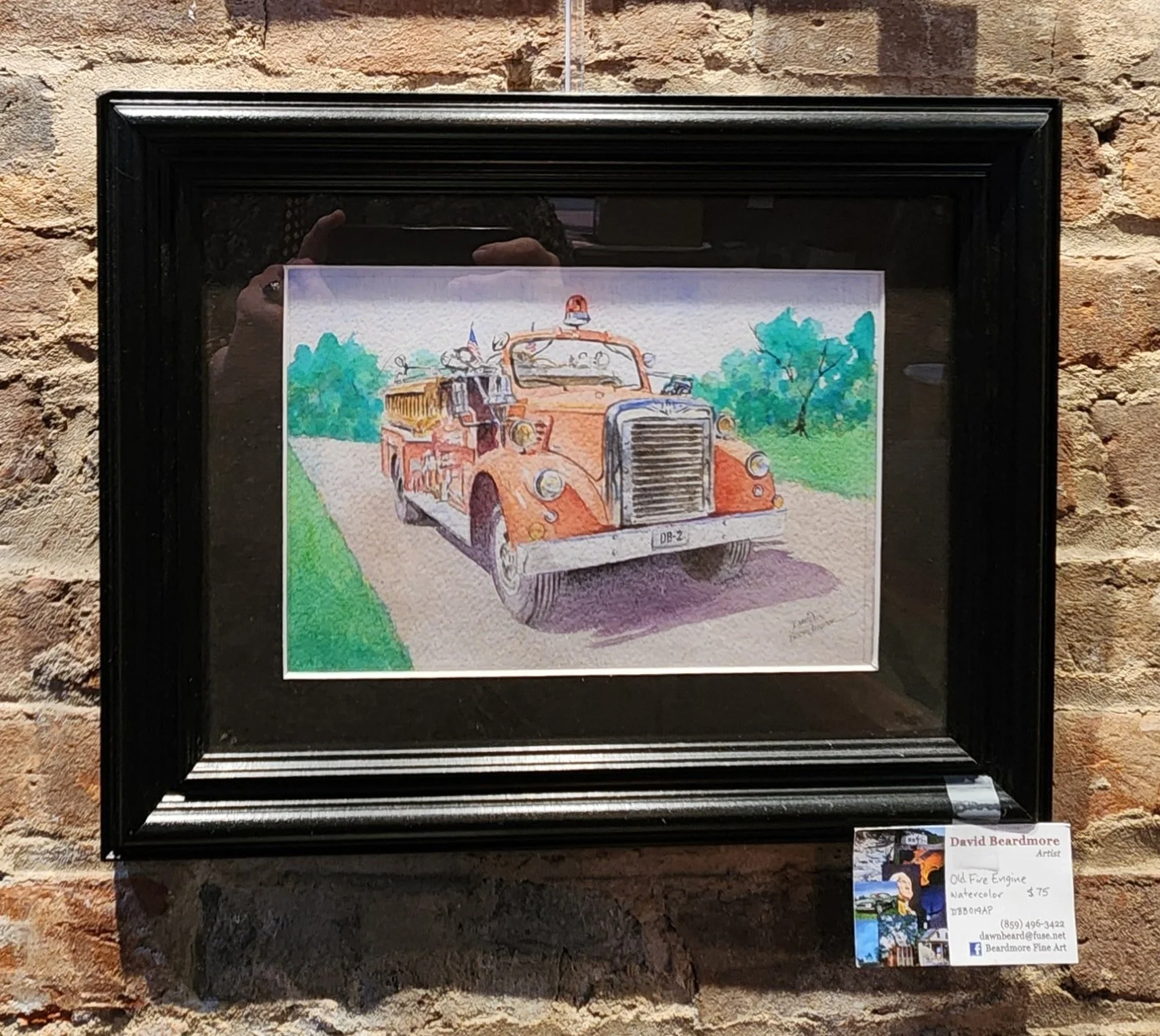 Watercolor painting of an old fire engine fire truck on a road with trees in the background