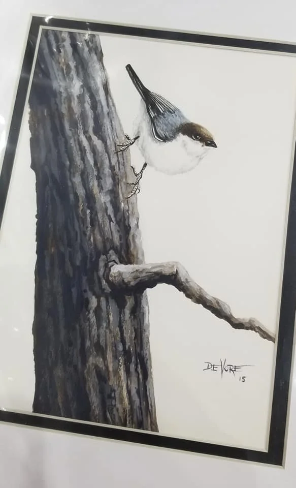Painting of a bird on a tree branch, blended with the tree trunk. The bird's head and wings are detailed, while the tree is painted in shades of gray and brown.