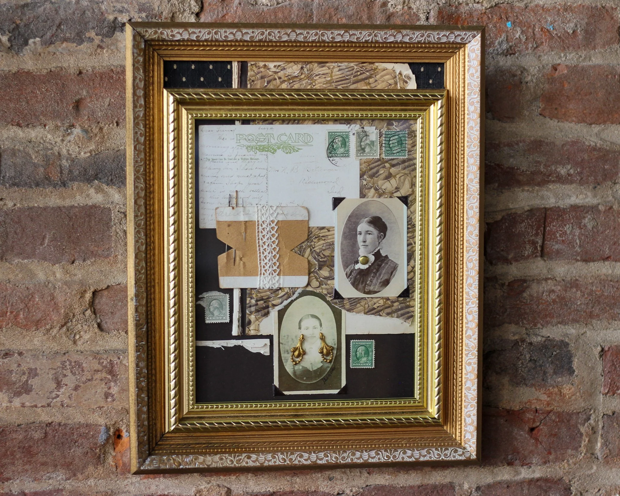 A collage of vintage photographs, postcards, and ephemera in a gold ornate frame on a brick wall.