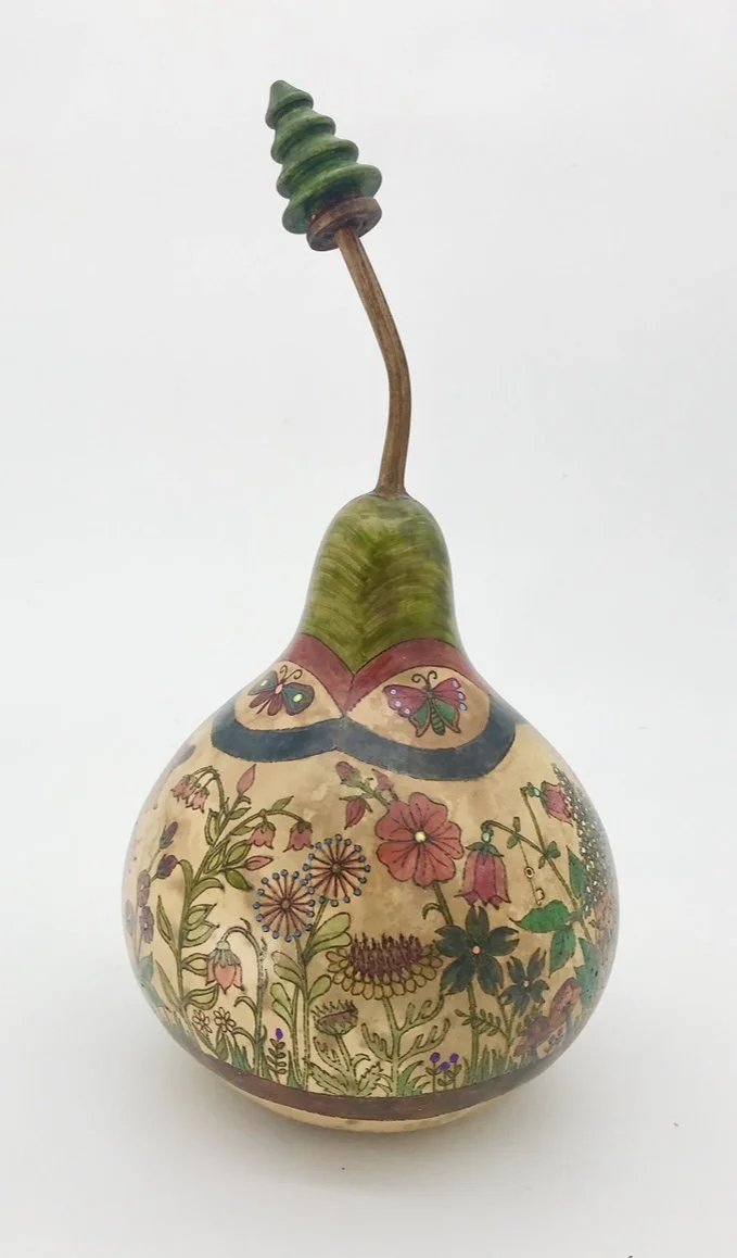 Decorative gourd with a painted floral and butterfly design, featuring a curved stem and colorful details.