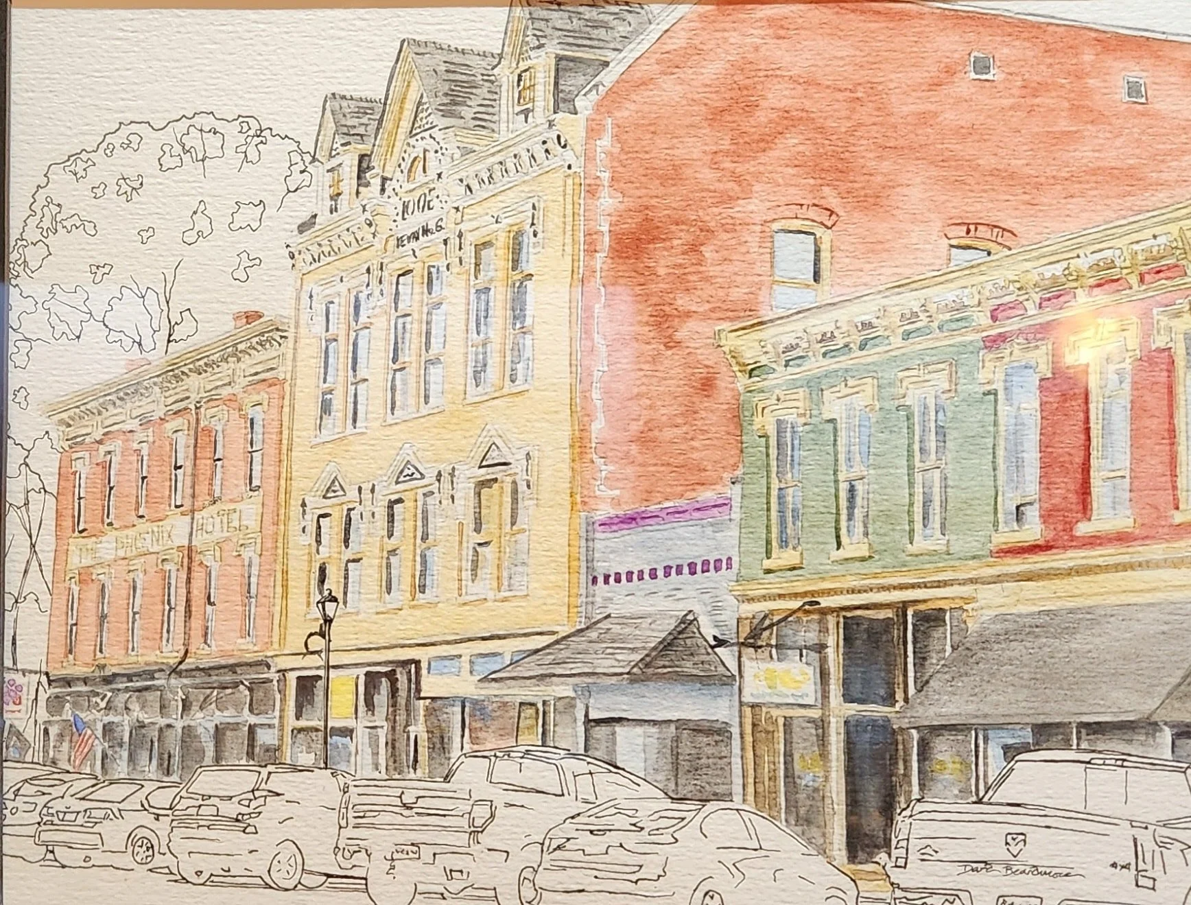 A watercolor painting of a city street with colorful old buildings, parked cars, a tree, and a streetlamp.