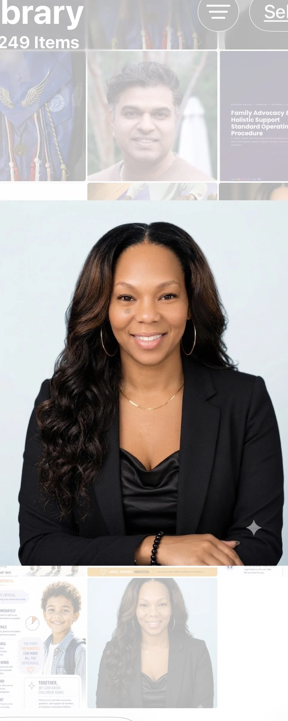 Portrait of Gwenelle Whitfield, a woman with wavy brown hair, wearing a black blazer, and hoop earrings.