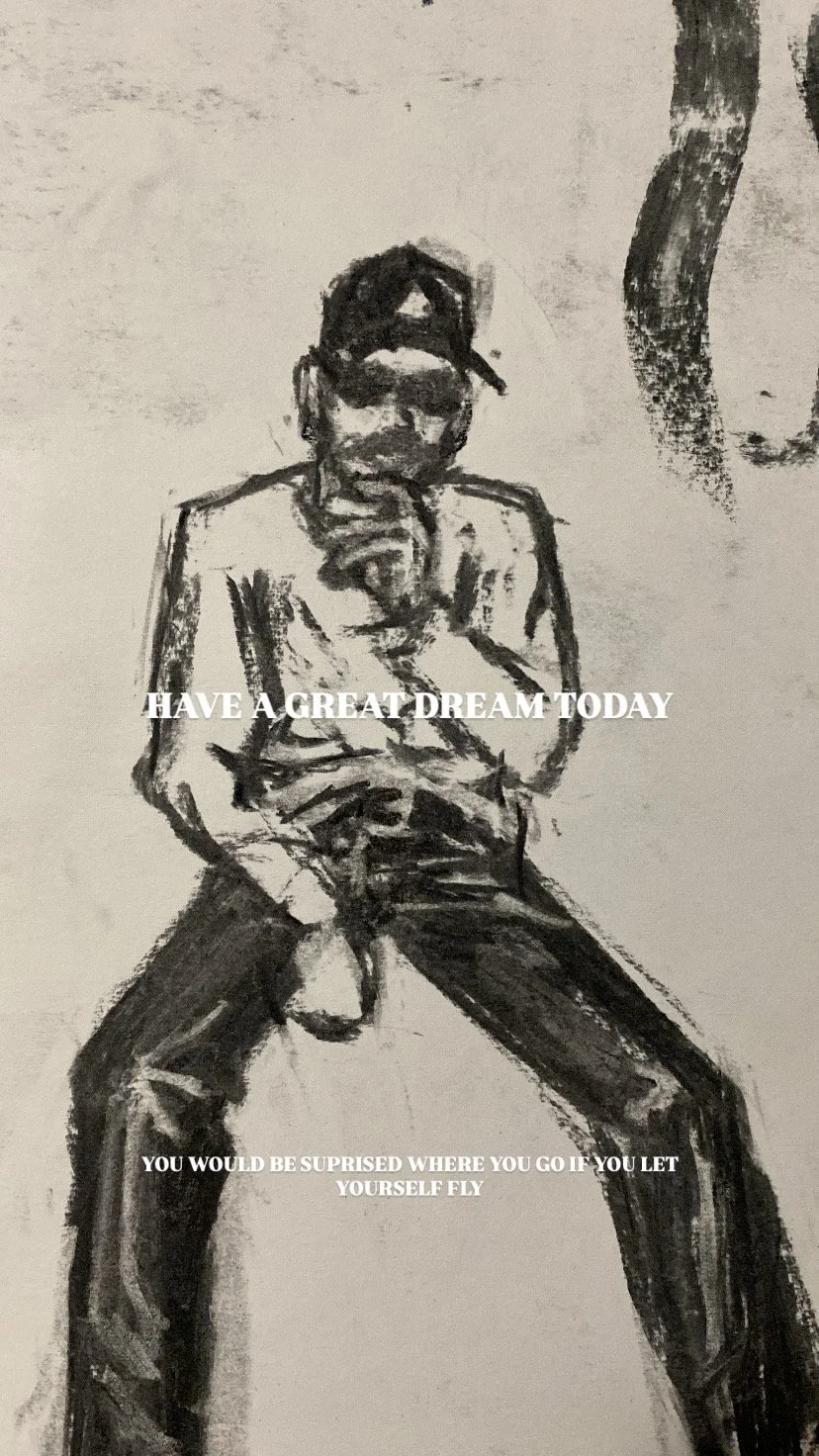 Black and white sketch of a man in a cap, sitting with his legs apart, wearing sunglasses, with text overlay that reads "HAVE A GREAT DREAM TODAY" and "YOU WOULD BE SURPRised WHERE YOU GO IF YOU LET YOURSELF FLY."