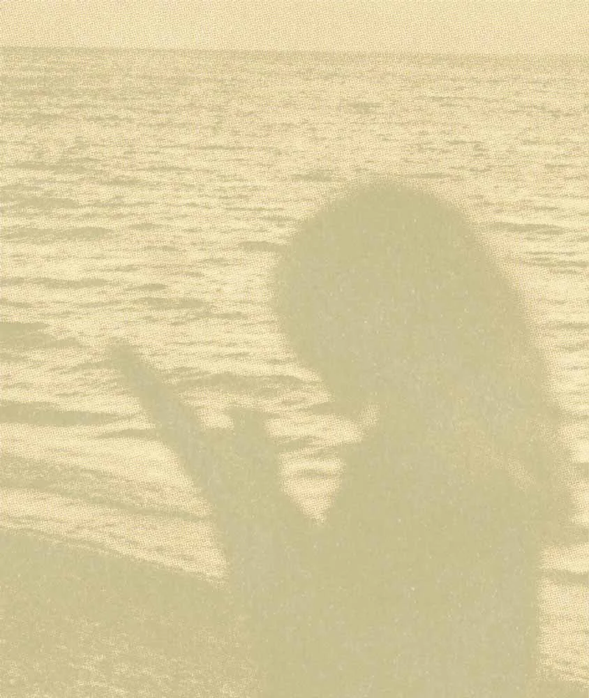 Faded halftone image of a woman in silhouette by the ocean, represents how working with a therapist for deep feelings can help you feel calmer.