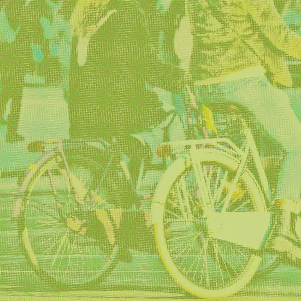 A faded, distressed photo of two people in jeans & faux fur coats riding bicycles.
