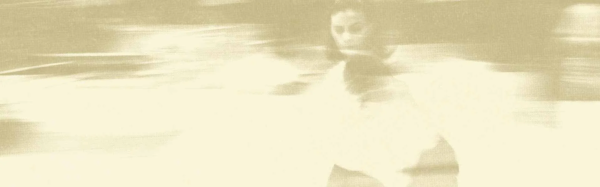 Sepia halftone image of a woman walking in the city, represents how anxiety therapy in Philadelphia can help you get back to your life.