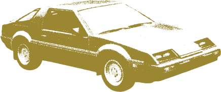 Gold-colored vintage 1980s sports car viewed from a three-quarter front angle.