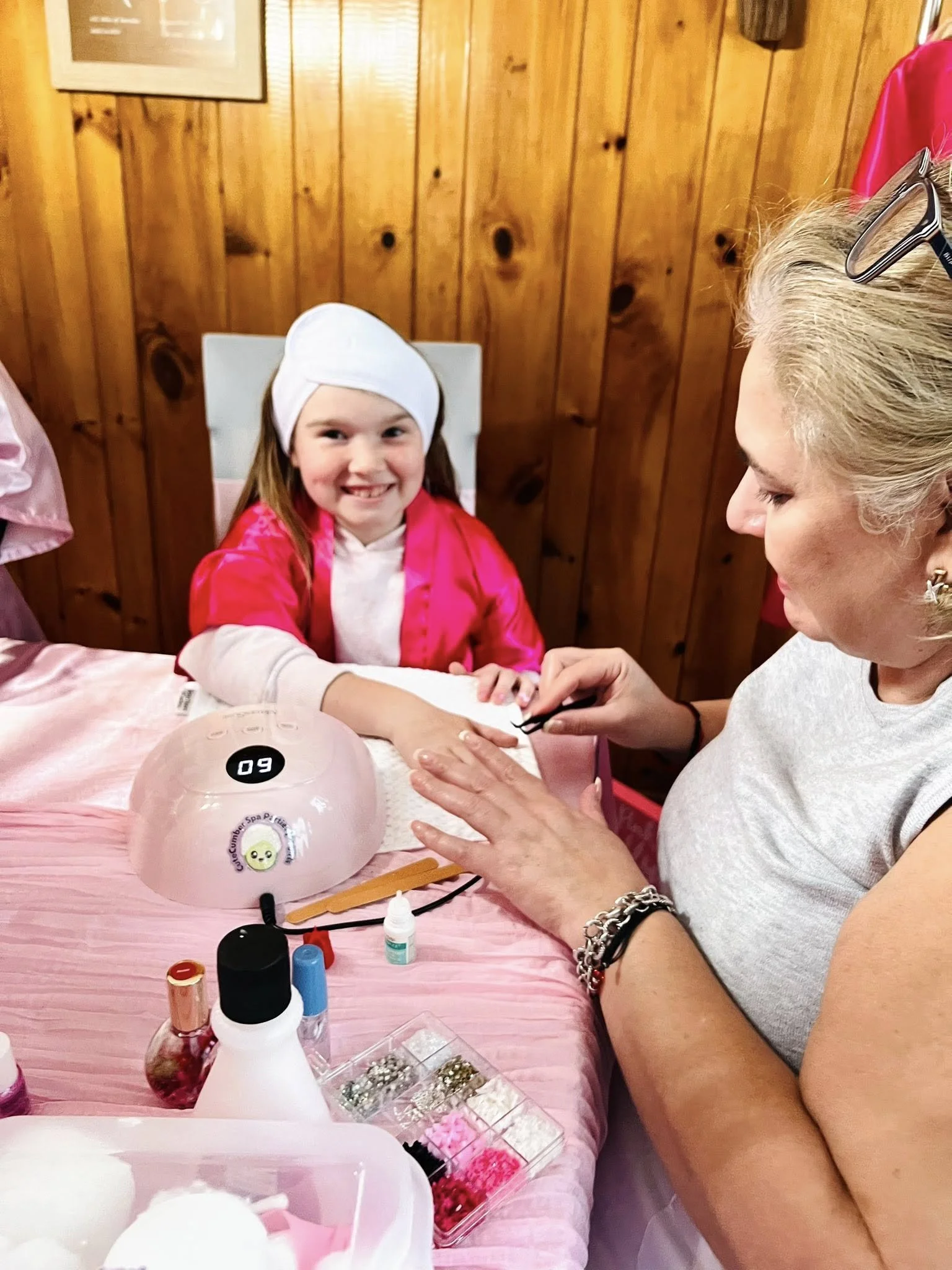 <img src="kids-nail-painting.jpg" alt="Children getting their nails painted at a Cutecumber spa birthday party">
