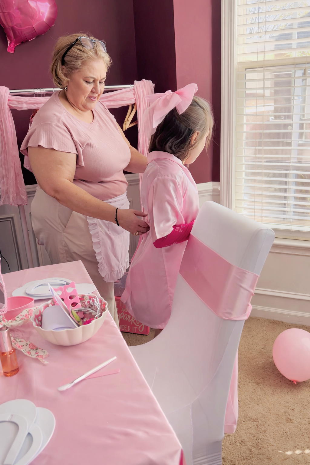 alt="kids spa party setup with robes cucumbers and face masks"