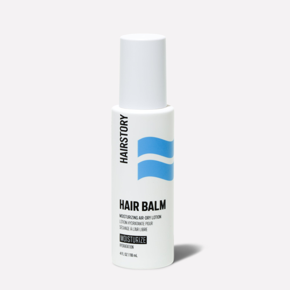 A photo of a hair balm bottle. Blue lines and black text on a white bottle.