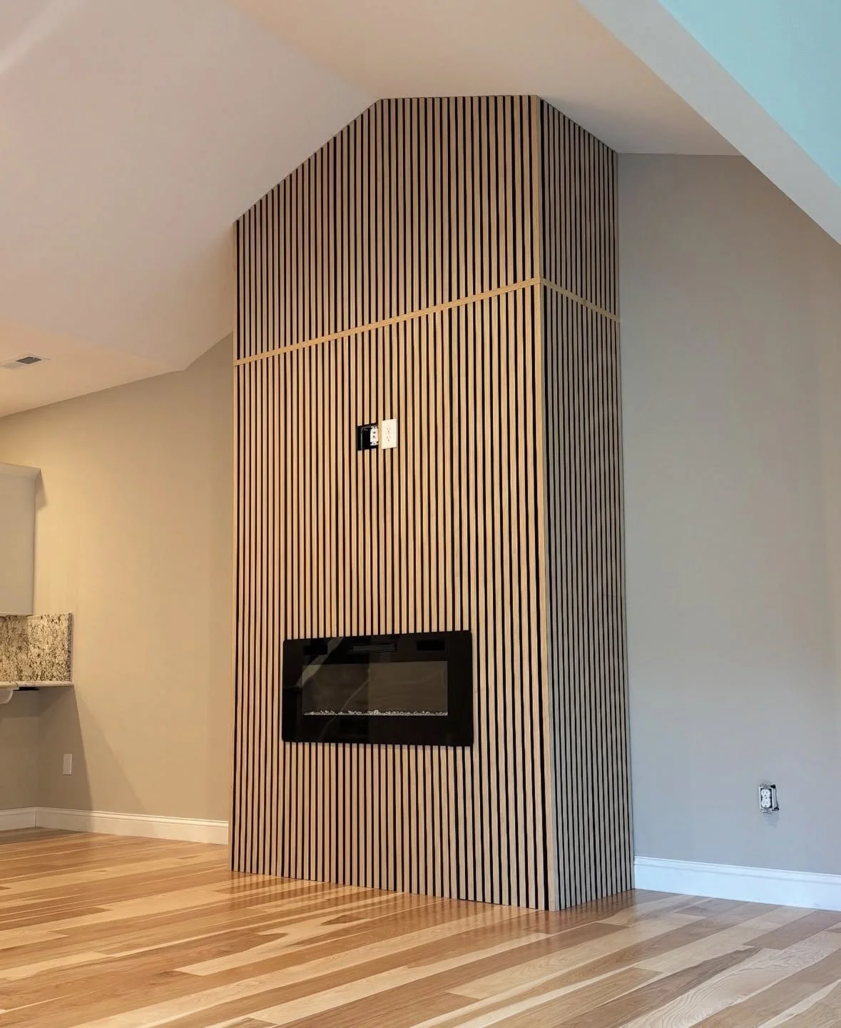 Fireplace oak panels installation. 