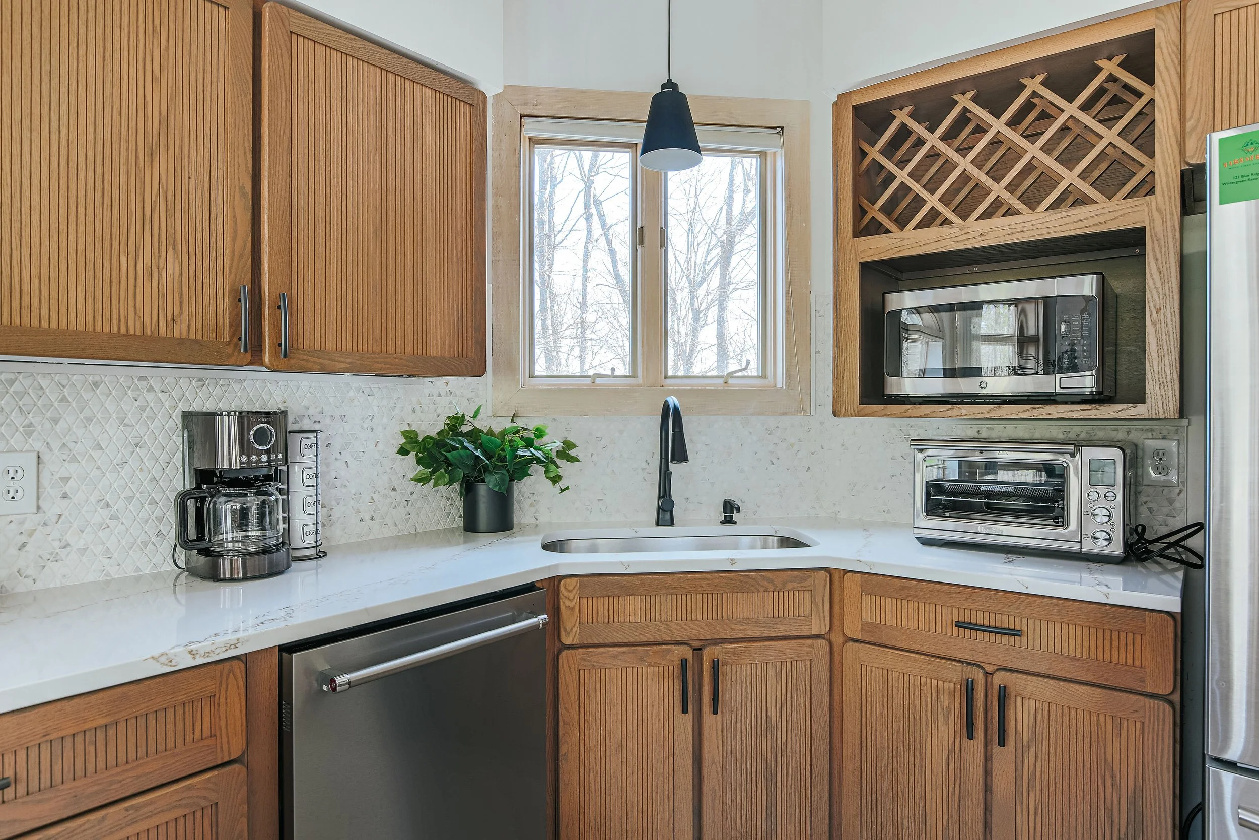 Kitchen Update- Full Refresh. 
New tile flooring updated countertops, backsplash installation, and new faucet for clean, modern finish.