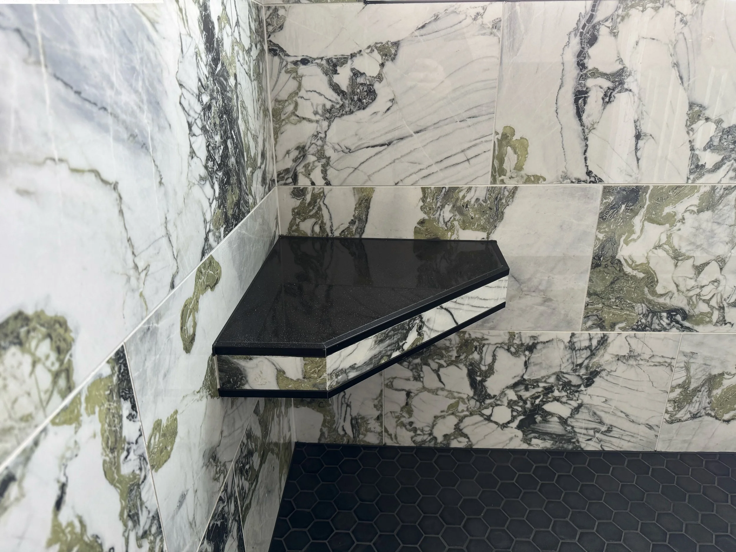 Master Bathroom Update - Modern Finishes.
Black trim accents, custom shelvings, and build-in bench, with full painting and new trim installation. 