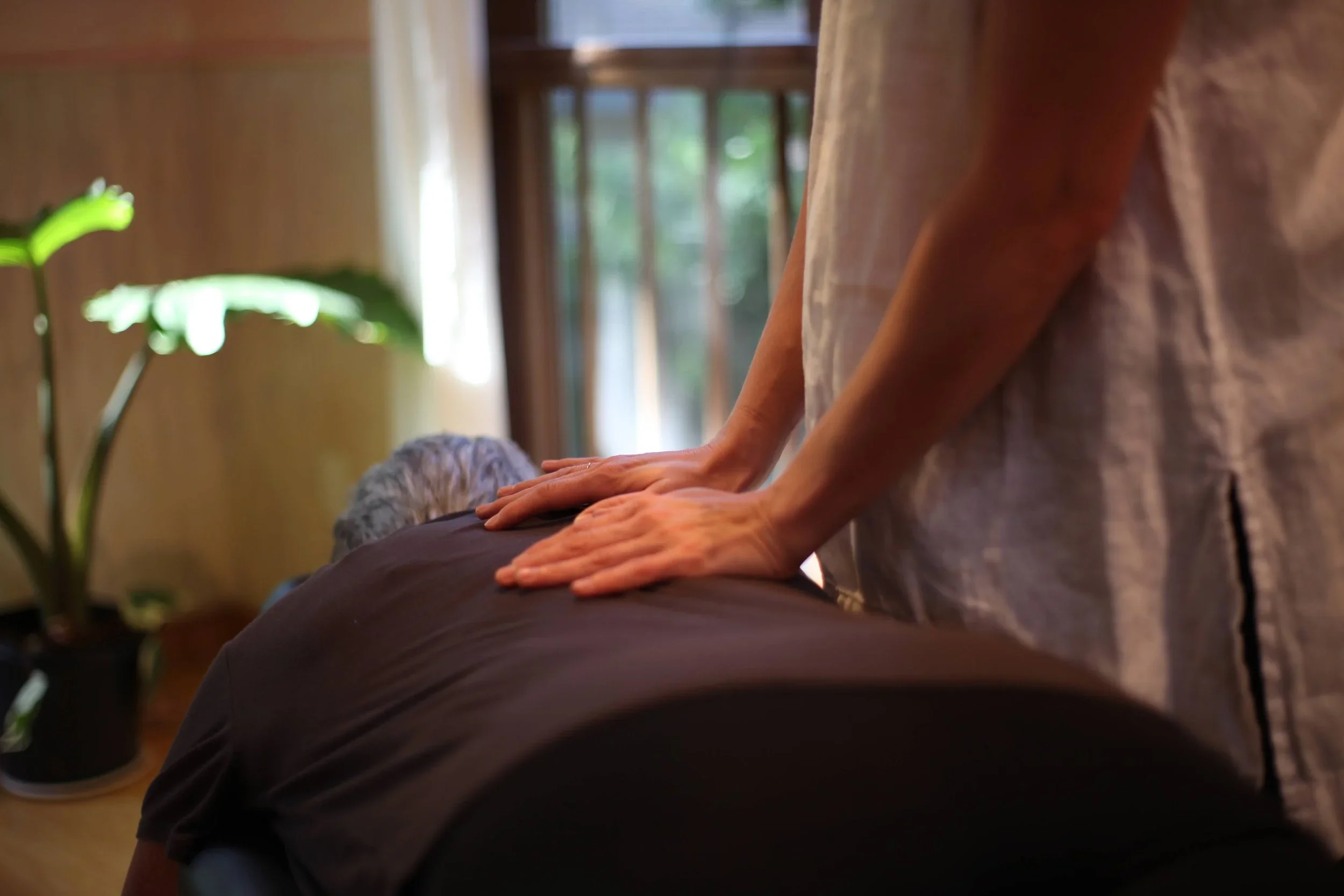 person receiving network spinal chiropractic adjustment from Chiropractor, Dr. Danielle Gonzales at Anam Cara Wellness in Portland, Oregon