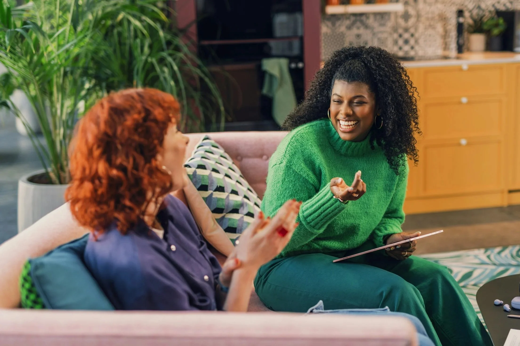 Woman in green enjoying her coaching discussion