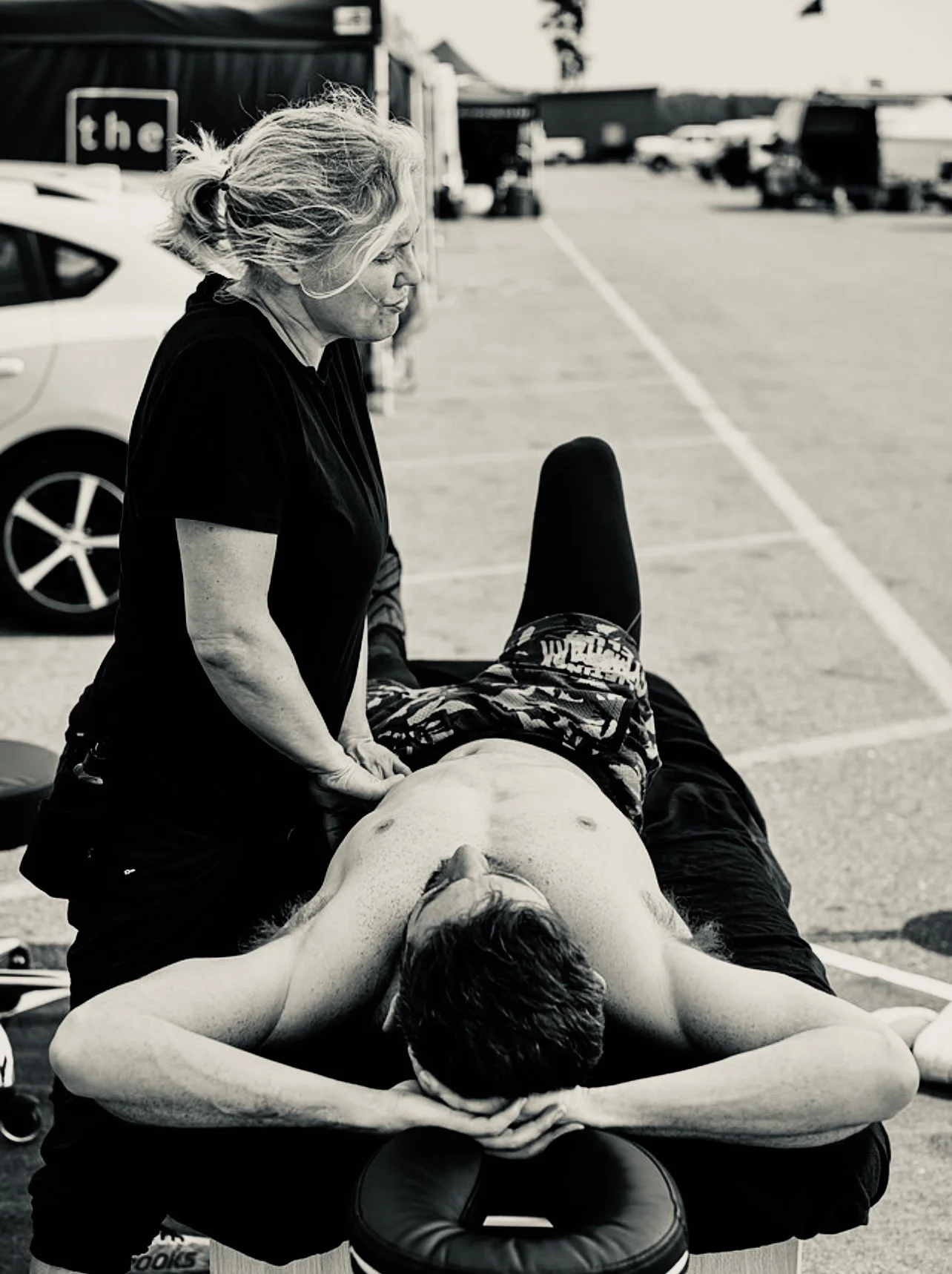 Amanda providing massage Trackside, photo by G. Powers Photography, all rights reserved.