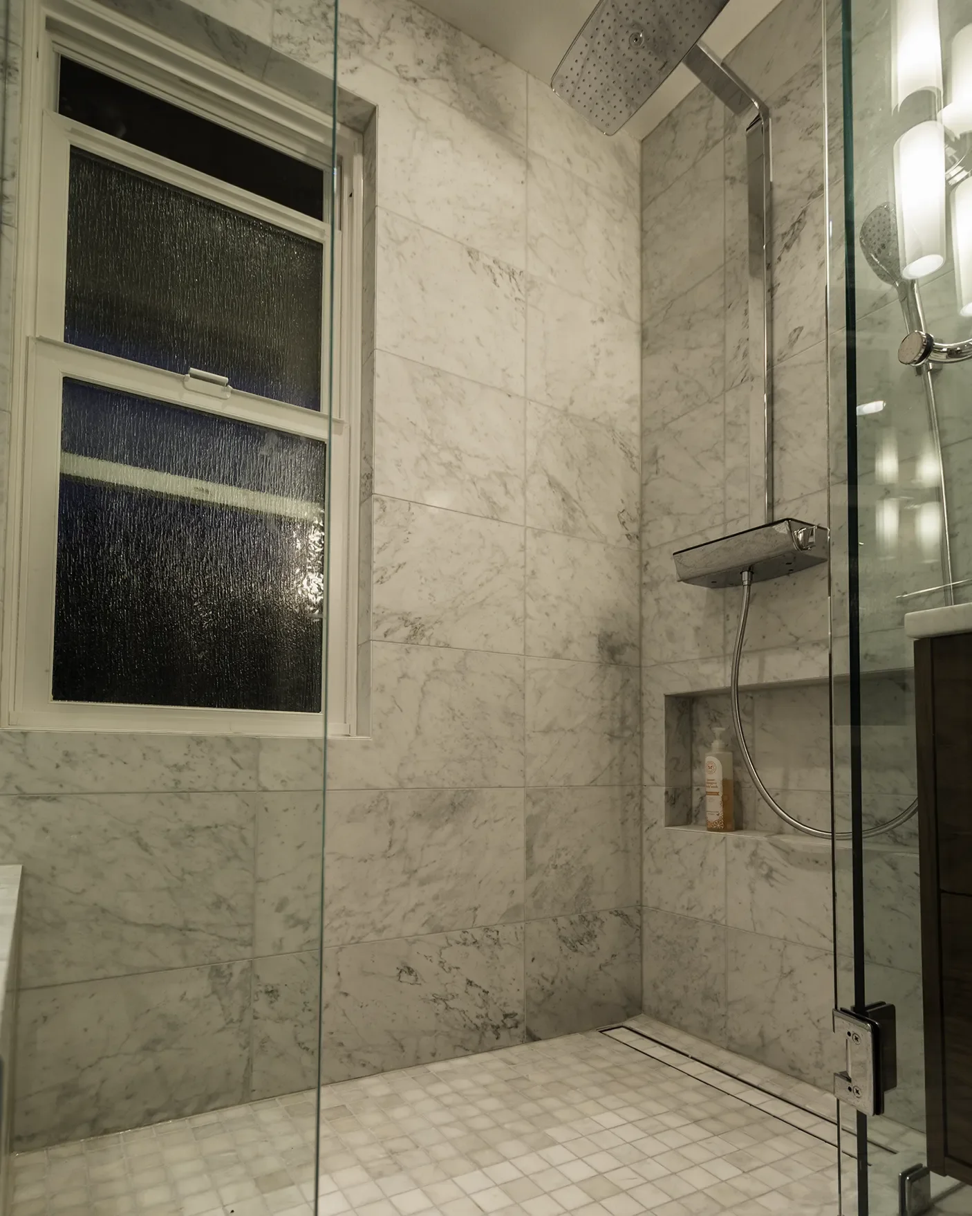 gig-harbor-bathroom-remodel-marble-tile-walk-in-shower-linear-shower-drain-rain-head.webp
