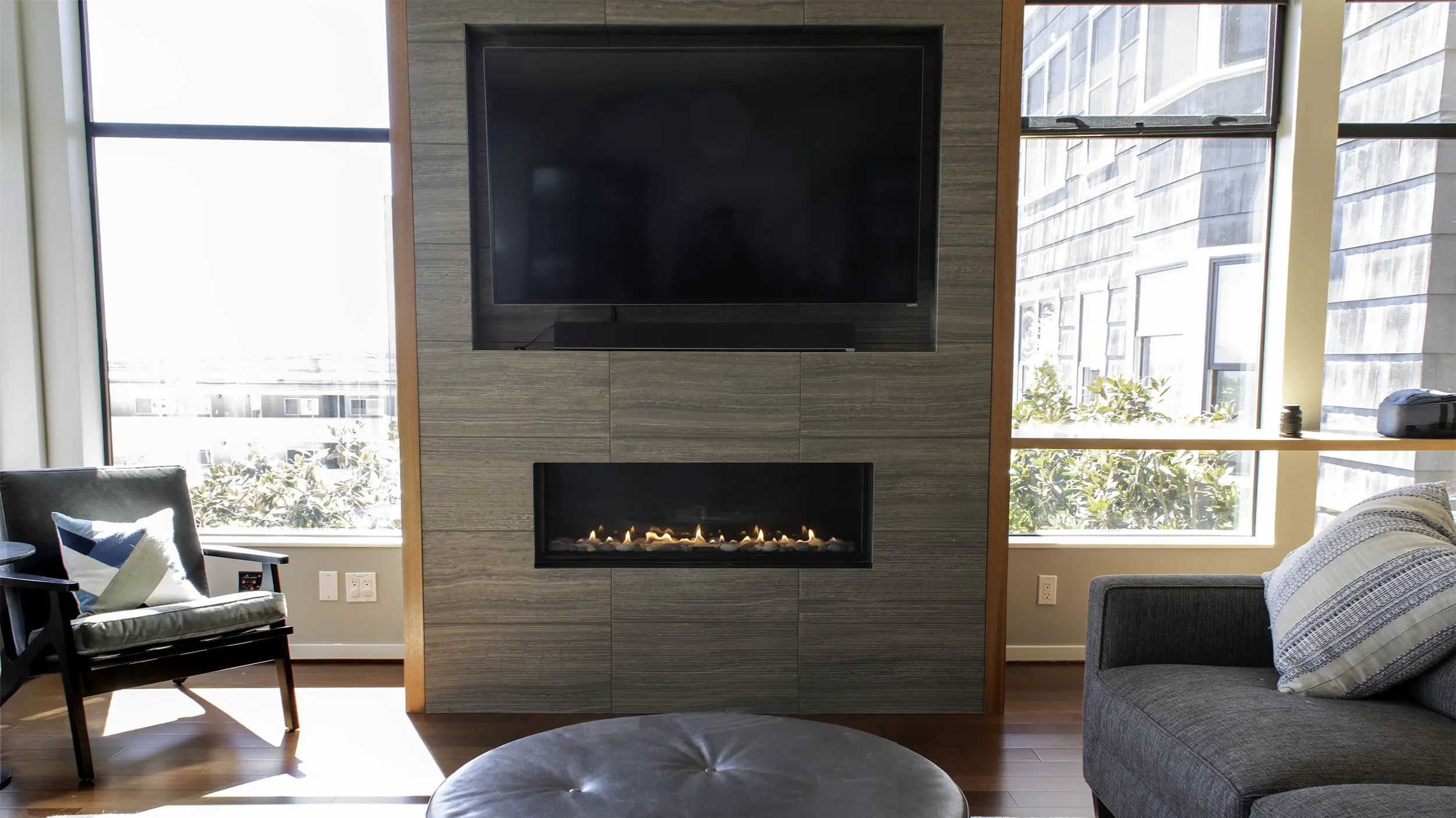 queen-anne-feature-wall-remodel-tile-fireplace-surround-integrated-media-storage.webp