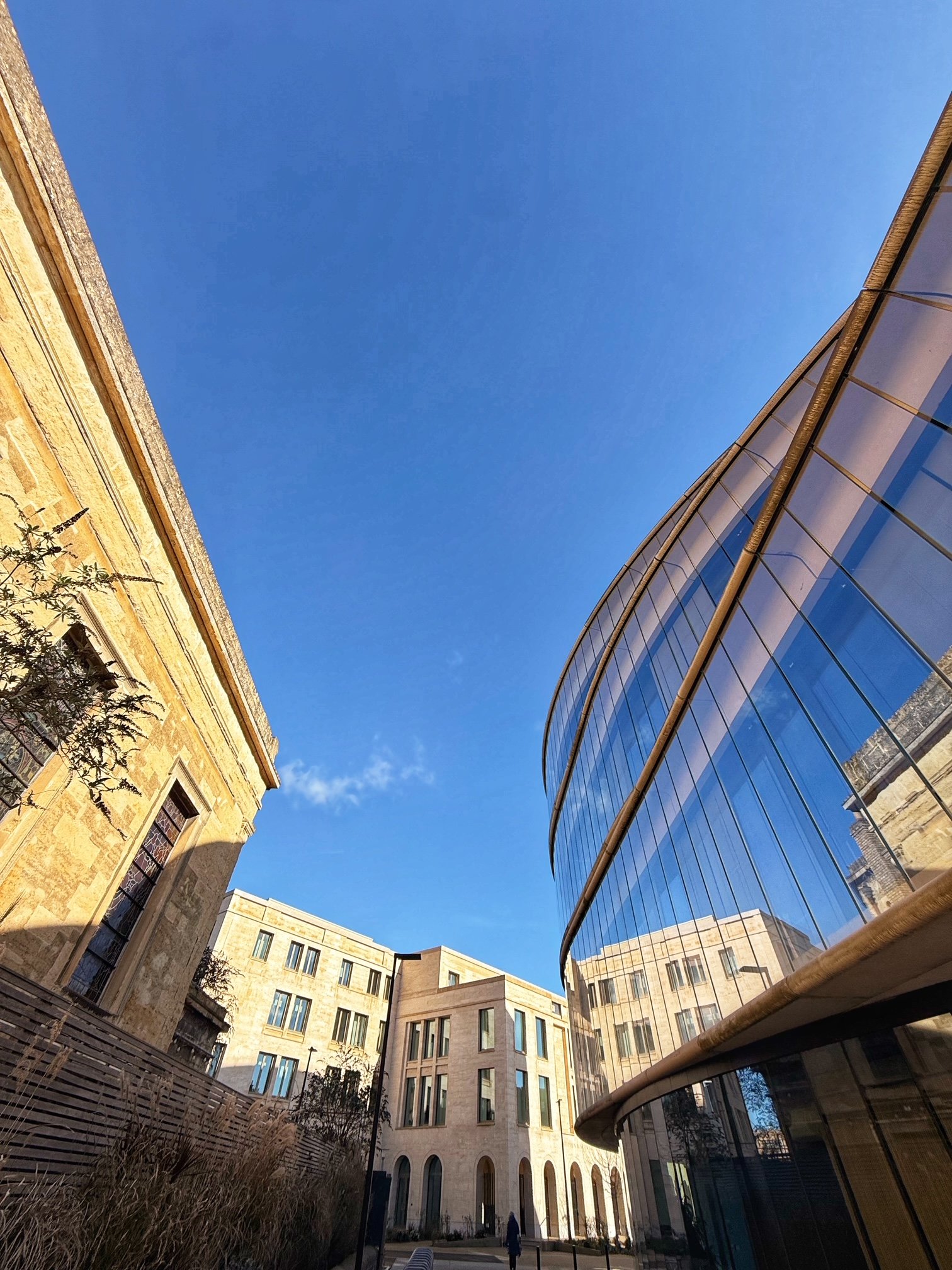 View of the Blavatnik School of Government alongside the old St Paul's church