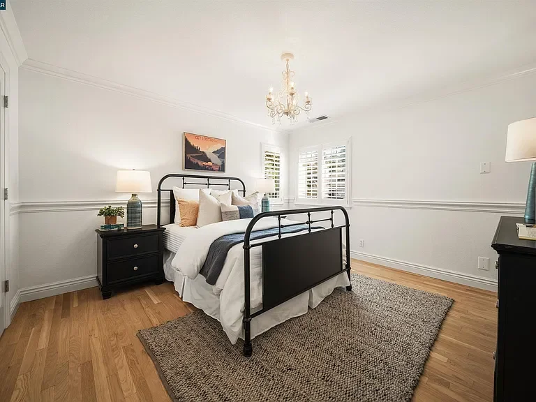 133-sunhaven-danville-guest-bedroom-black-metal-bed.webp
