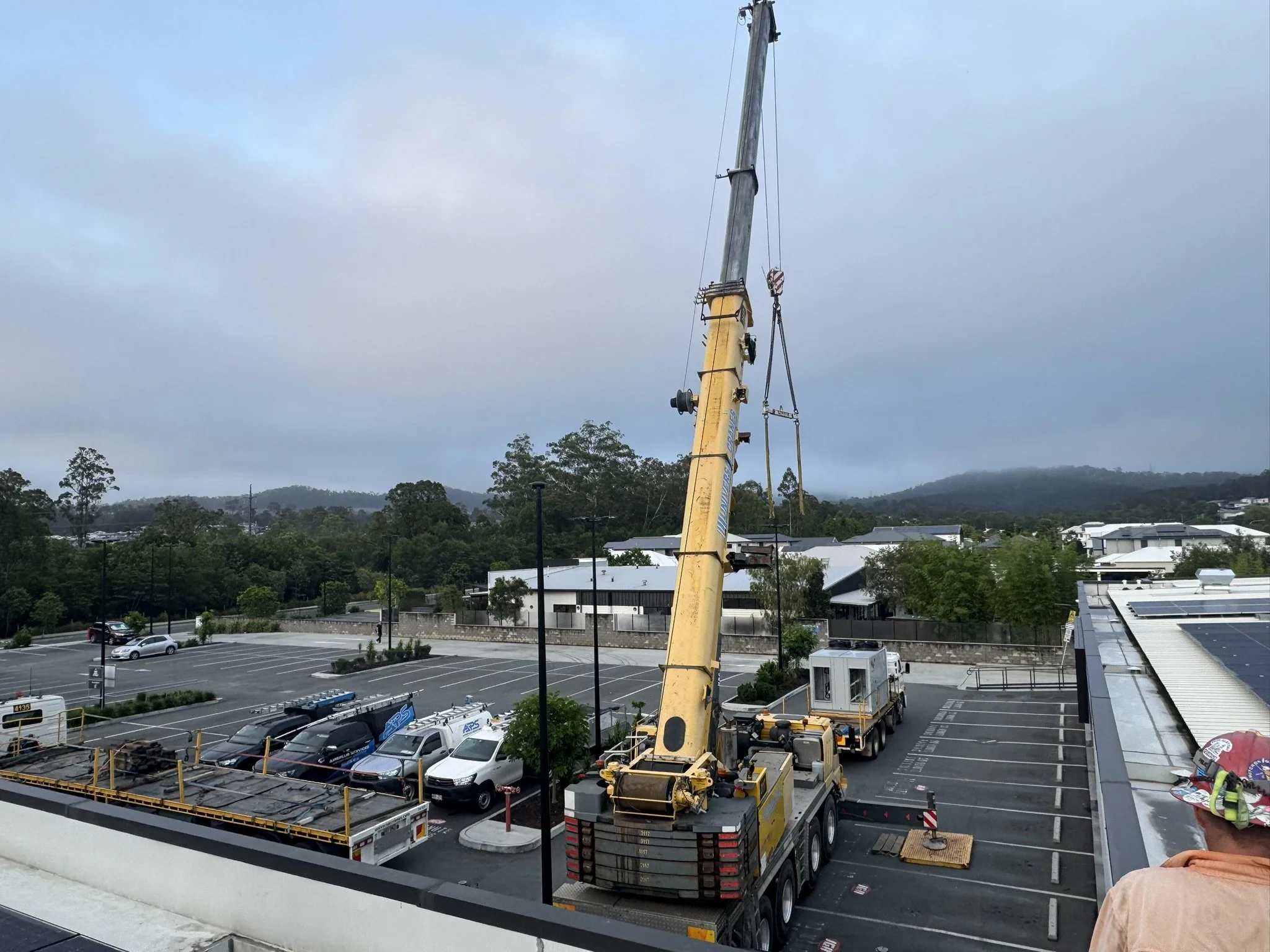 Crane set up to lift units for a commercial gym fitout.