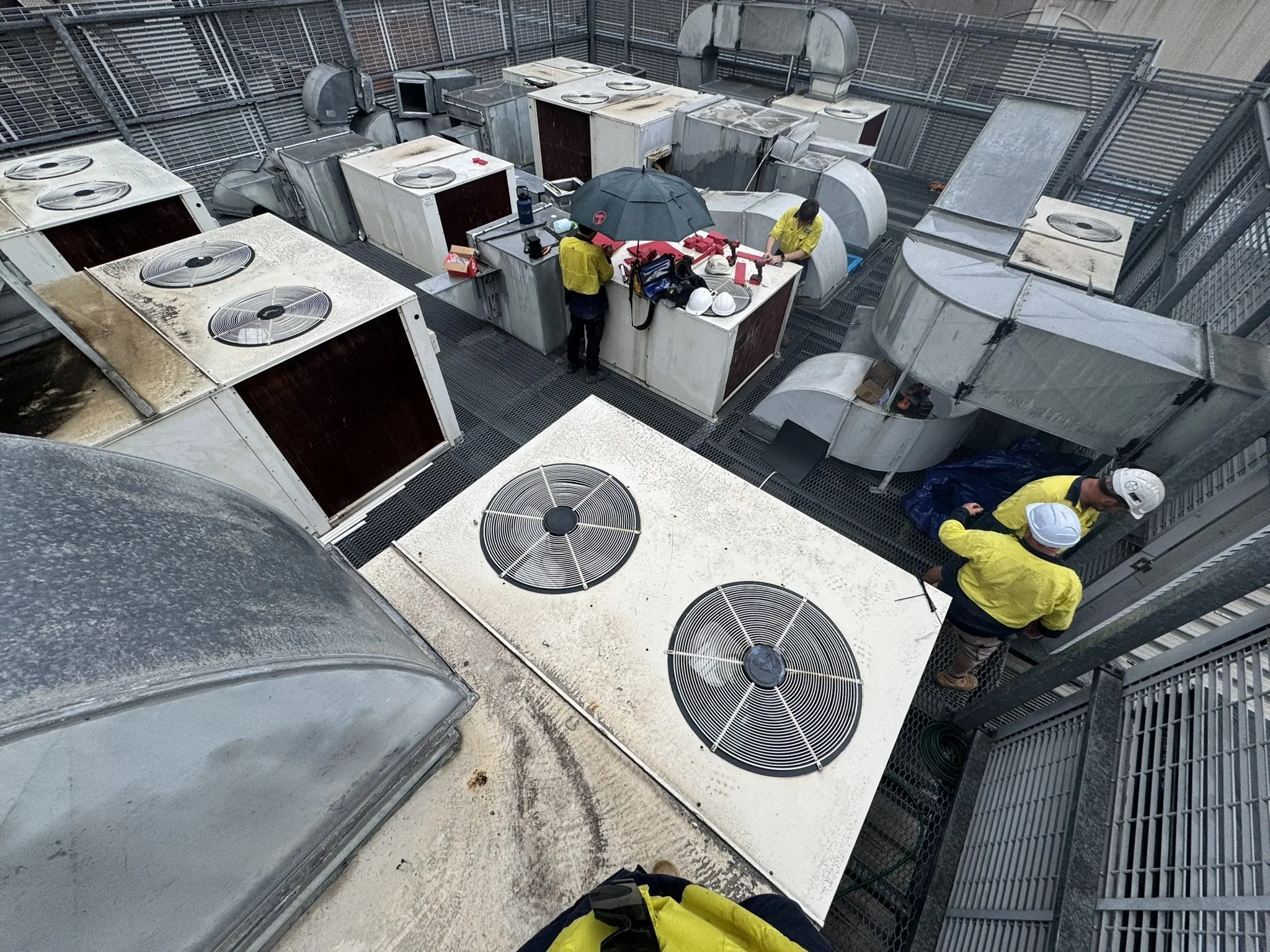Before disconnection. Replacement of 9 rooftop package units and full rooftop duct upgrade across a commercial building in Brisbane CBD.