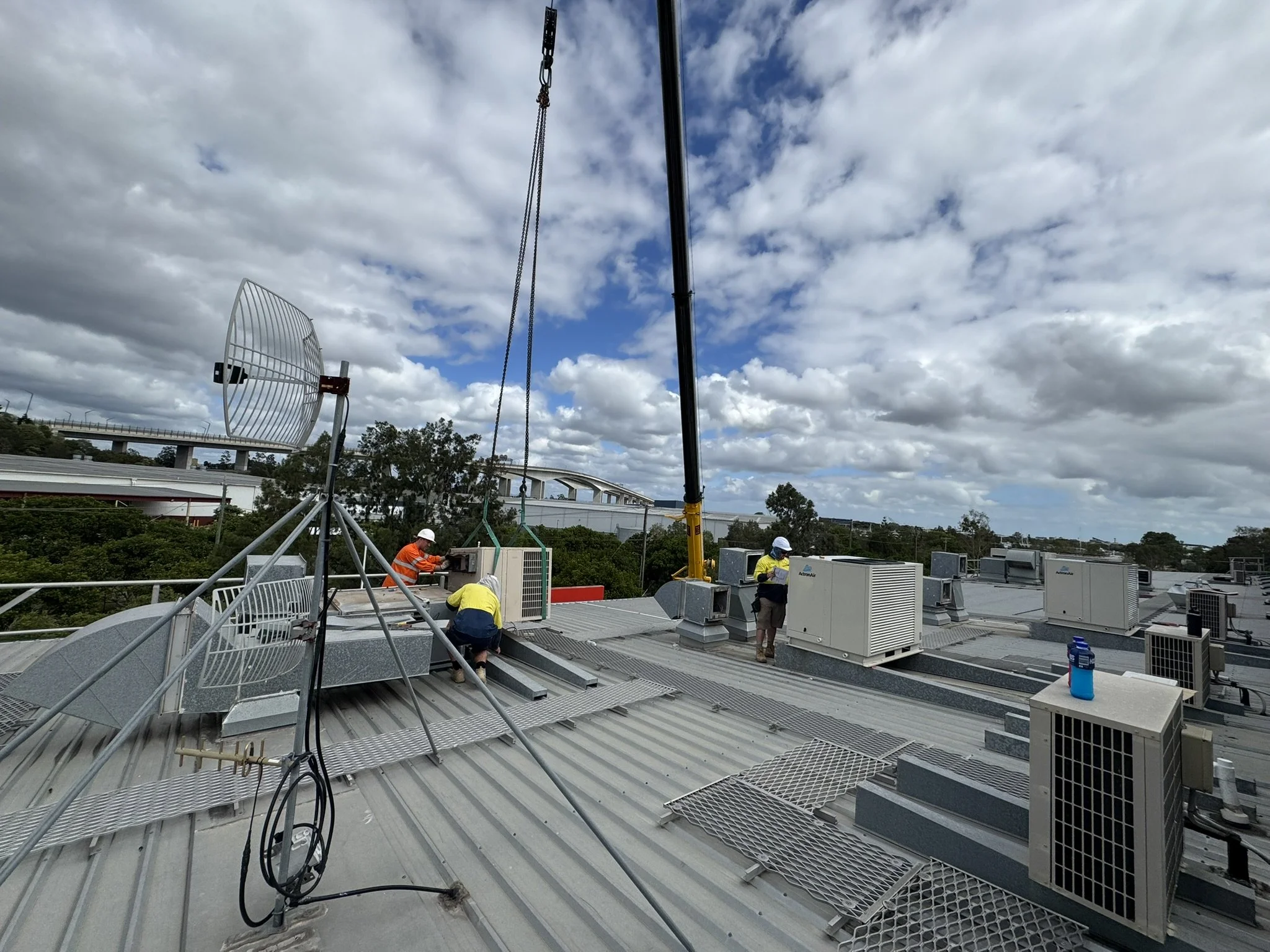 Package unit being landed by a crane in Brisbane.