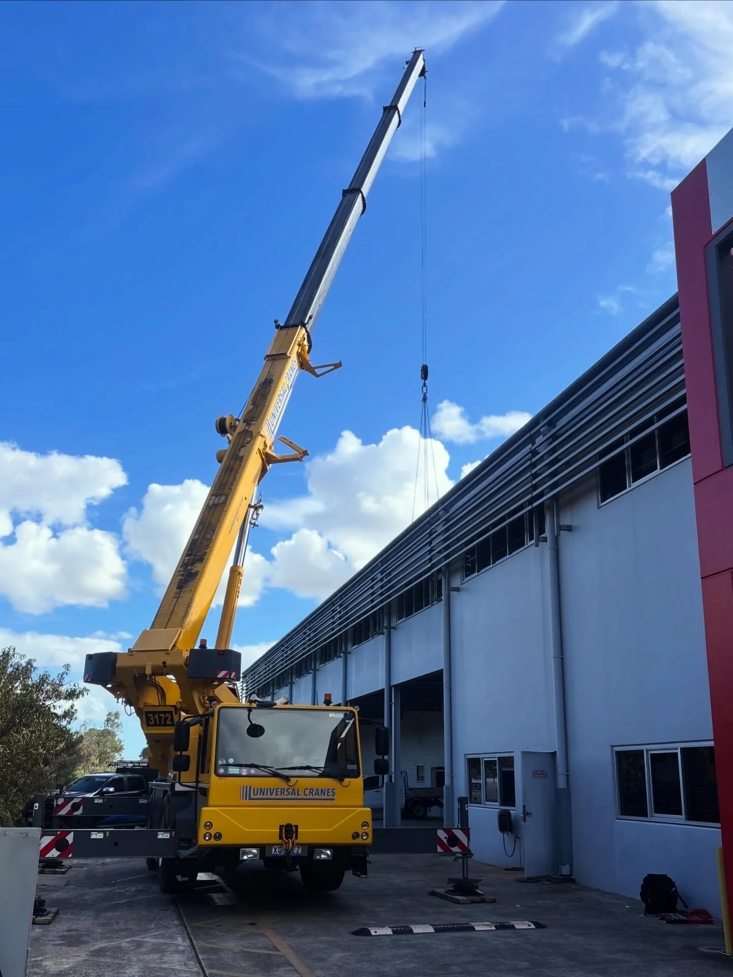 Crane setup for 6 package unit and 5 ducted split systems install.