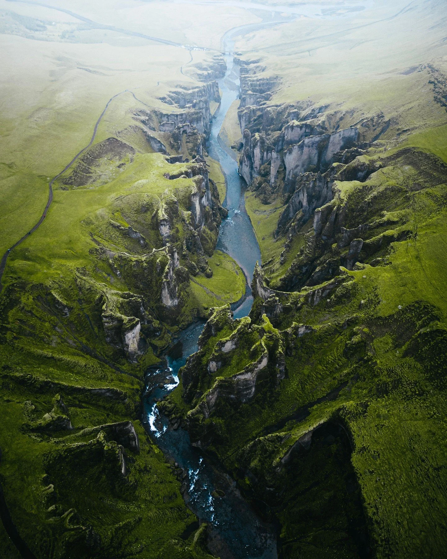 Nature&rsquo;s grandest design, carved by time and draped in the vibrant emerald of the Icelandic summer. 

Stand on the edge of Fja&eth;r&aacute;rglj&uacute;fur, where ancient canyon walls meet the whisper of glacial waters under the endless golden 
