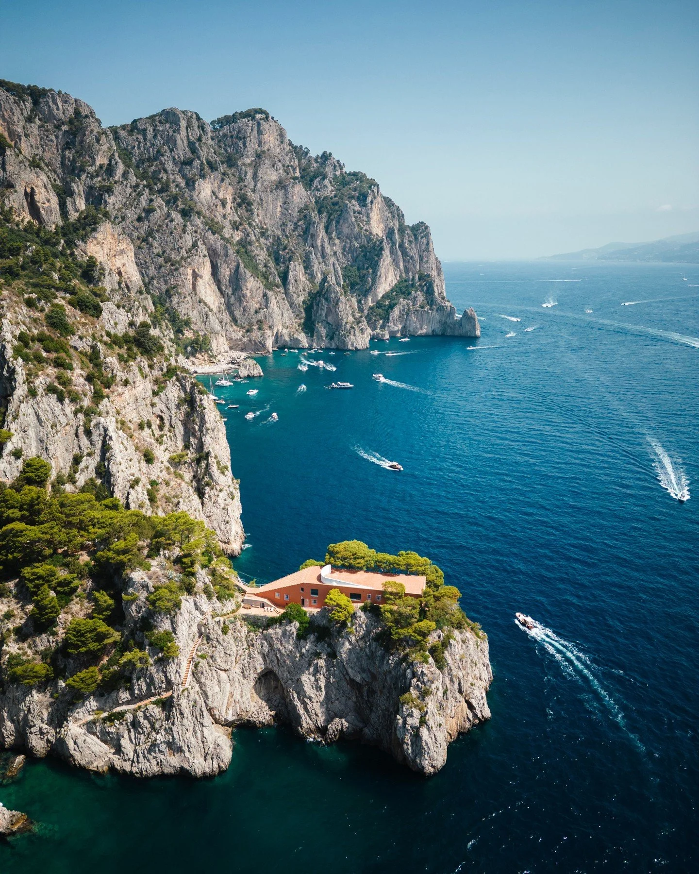 Capri&rsquo;s legendary limestone cliffs carve a dramatic silhouette against the infinite blue of the Tyrrhenian Sea. 

Picture sun-drenched afternoons spent aboard a private Riva, the scent of wild lemon orchards drifting on the warm salt breeze. 

