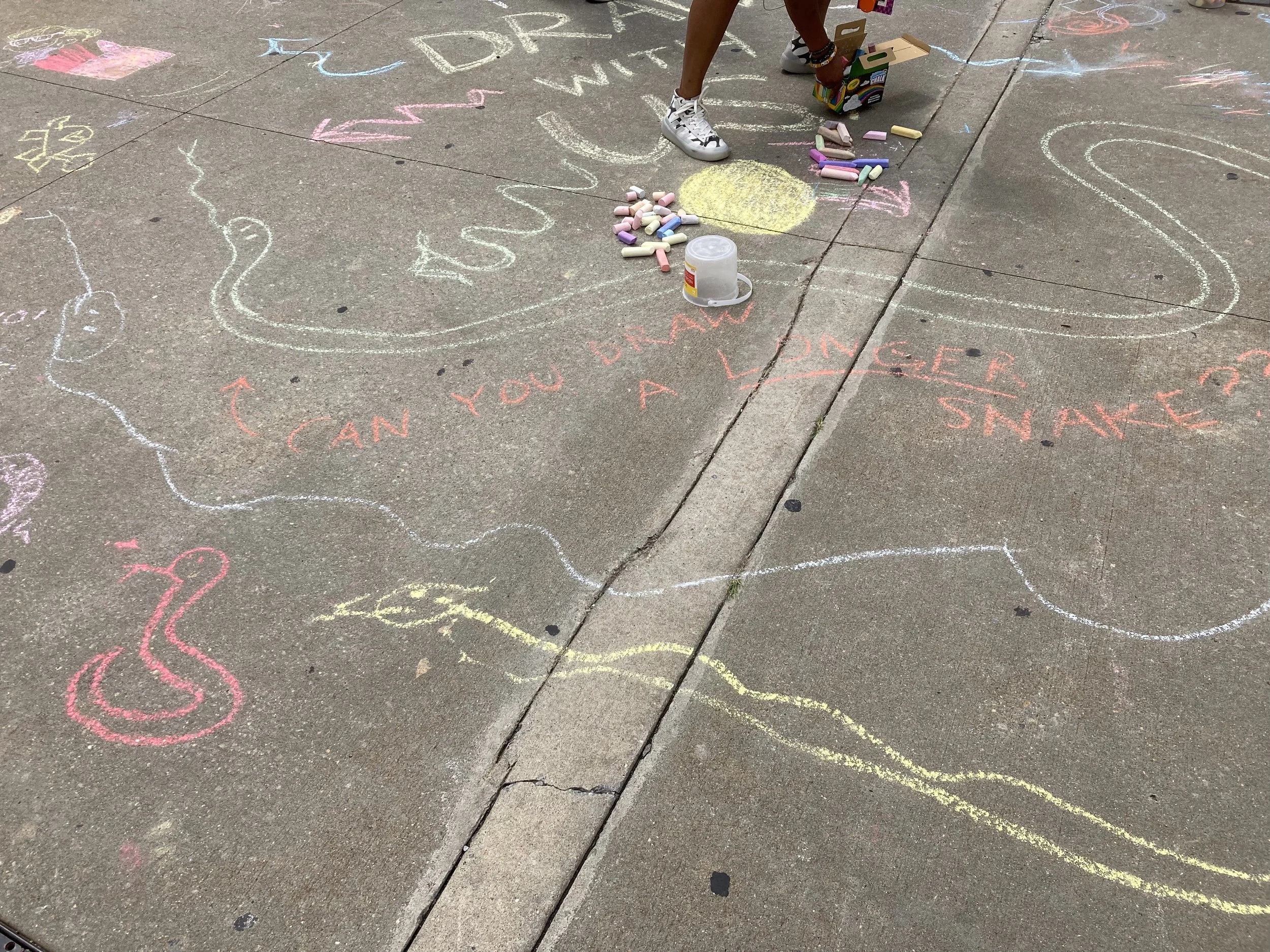 The longest snake competition at the Brooklyn Museum, c. 2023.