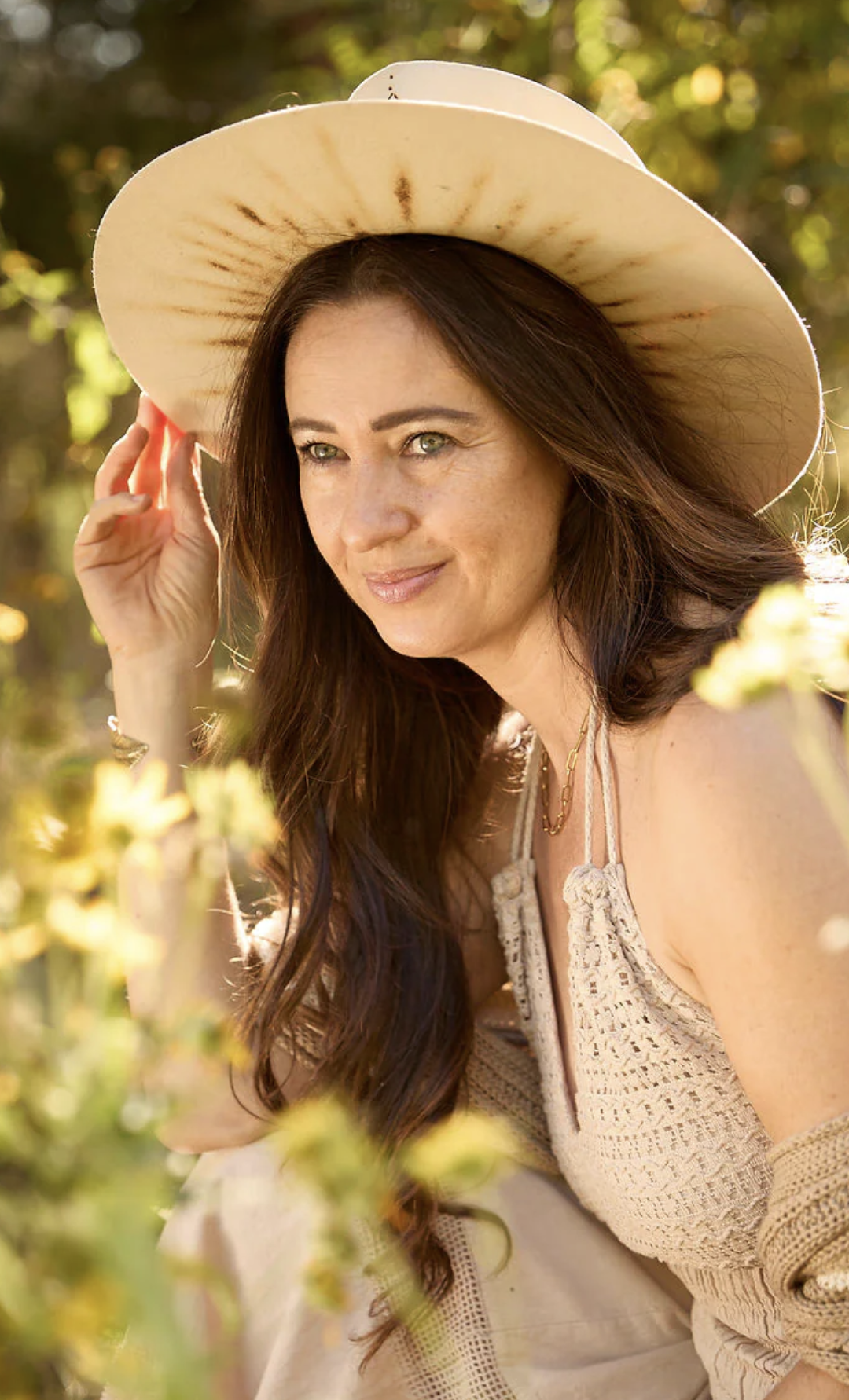 Woman with a wide brimmed hat.