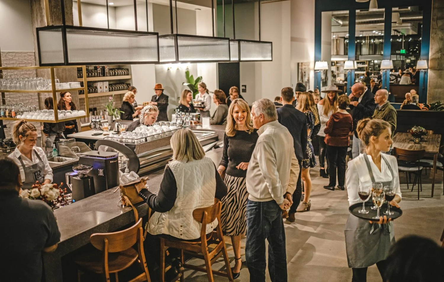 Frank & Roze private event with numerous people engaged in conversations