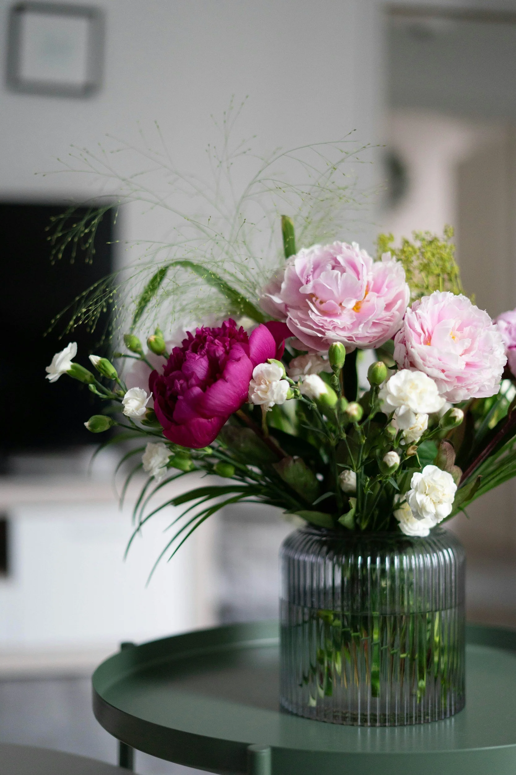 White, pink, and violet flowers in vase