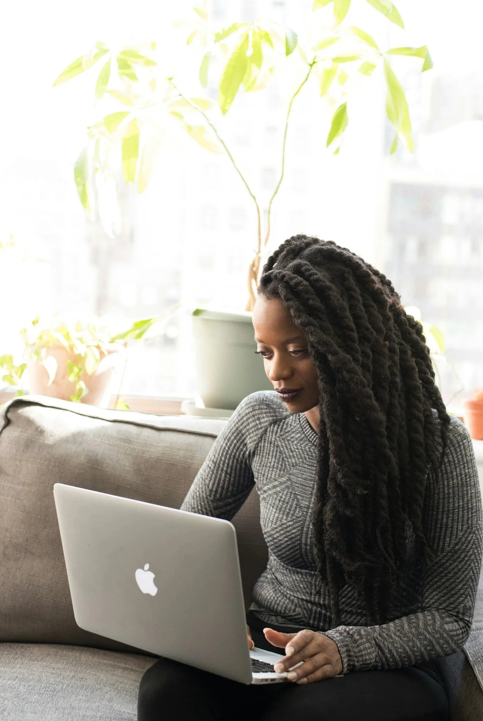 Professional woman on laptop in living room