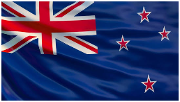 Close-up of the New Zealand flag with a blue background, red and white union jack, and four red stars with white borders.