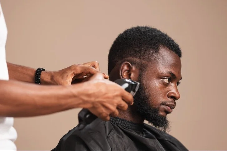 Taper Fade with Beard:
A subtle taper around the neckline and temples paired with a well-groomed beard. This style offers a balanced, professional look suitable for both casual and formal settings.