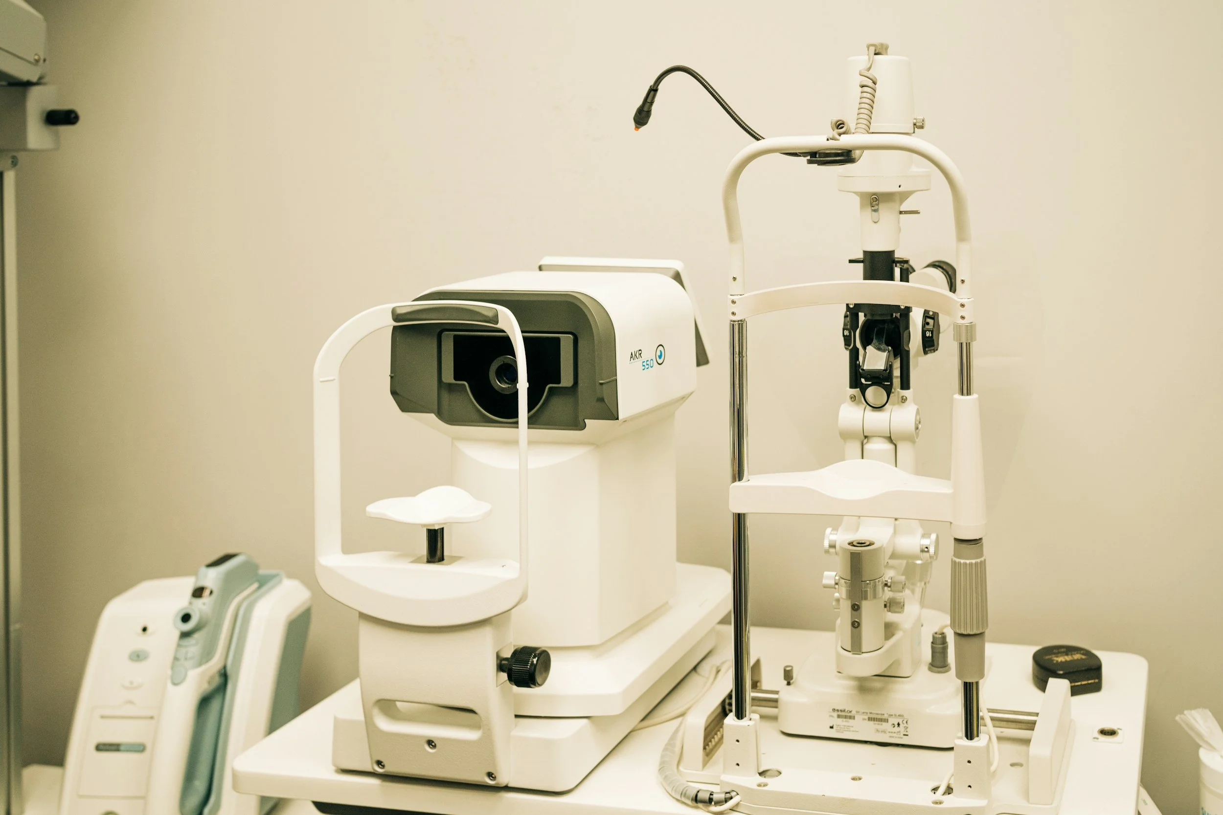 Medical examination room features a slit lamp and optical coherence tomography (OCT) device.